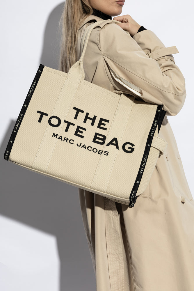 Marc Jacob Canvas Shopper Tote Bag with large black text on a beige canvas background.