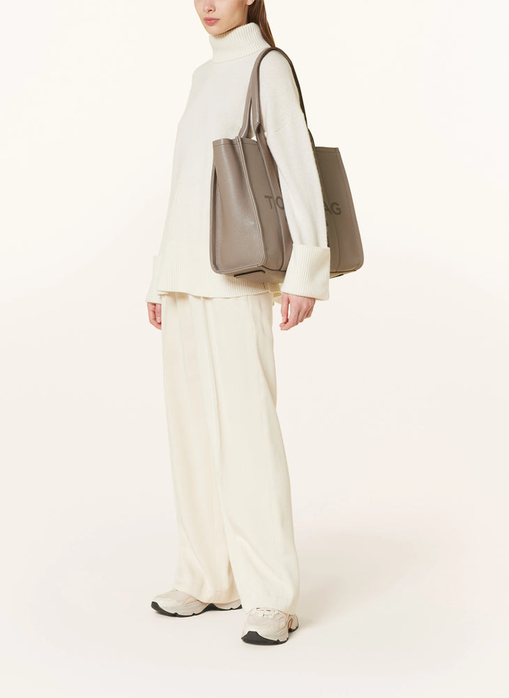 Marc Jacobs Shopper Tote Bag Leather Beige displayed on a light background, showcasing its spacious design and stylish look.