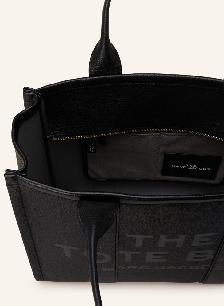 Marc Jacobs Shopper Medium Tote Bag Leather Black on a light background, showcasing its elegant design and sleek silhouette.