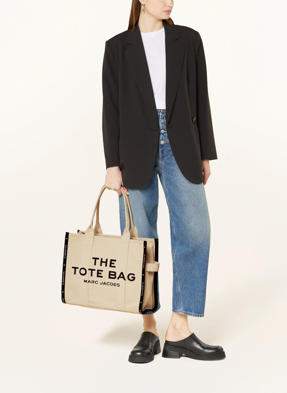 Marc Jacob Canvas Shopper Tote Bag with large black text on a beige canvas background.
