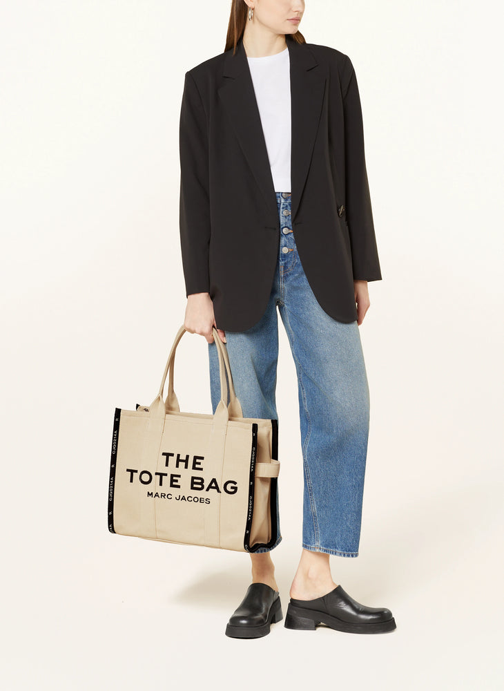 Marc Jacob Canvas Shopper Tote Bag with large black text on a beige canvas background.