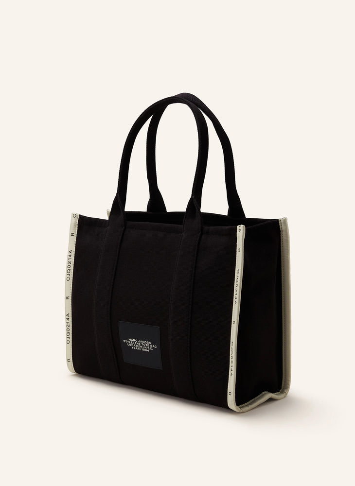 Marc Jacob Canvas Shopper Tote Bag in black with bold white lettering, stylish and practical for everyday use.