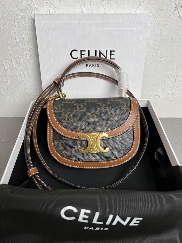 Celine handbag with monogram pattern and gold clasp on a Celine branded box.