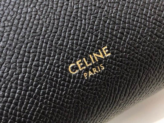 Close-up of a black textured surface with 'CELINE PARIS' logo.