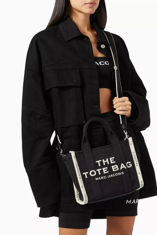 Marc Jacob Canvas Shopper Tote Bag in black with bold white lettering, stylish and practical for everyday use.