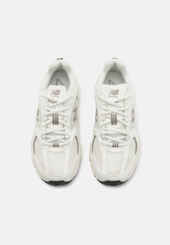 New Balance 530 Sneaker White Beige side view featuring a clean and comfortable design.