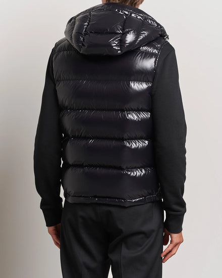 Women/ men Black puffer vest worn by a person. Moncler unisex Bormes down vest jacket
