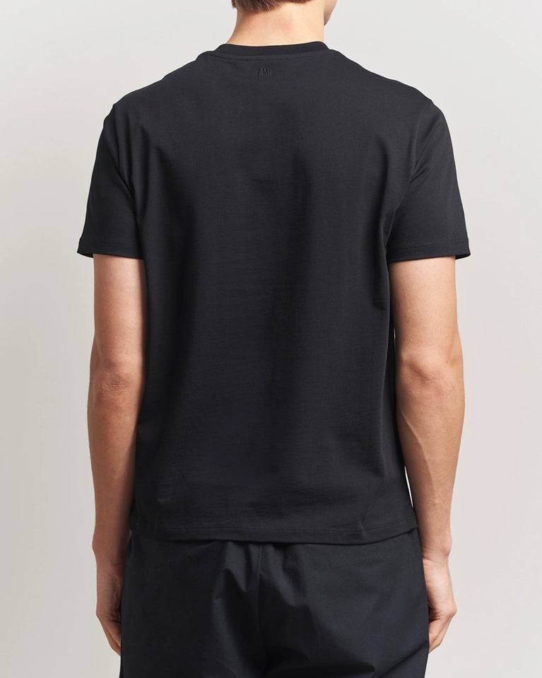 AMI Paris Heart Logo Men Tshirt in black with red heart logo design.