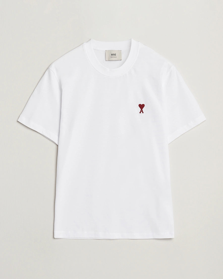 AMI Paris Heart Logo Men Tshirt featuring a white color and a red heart logo on the chest.