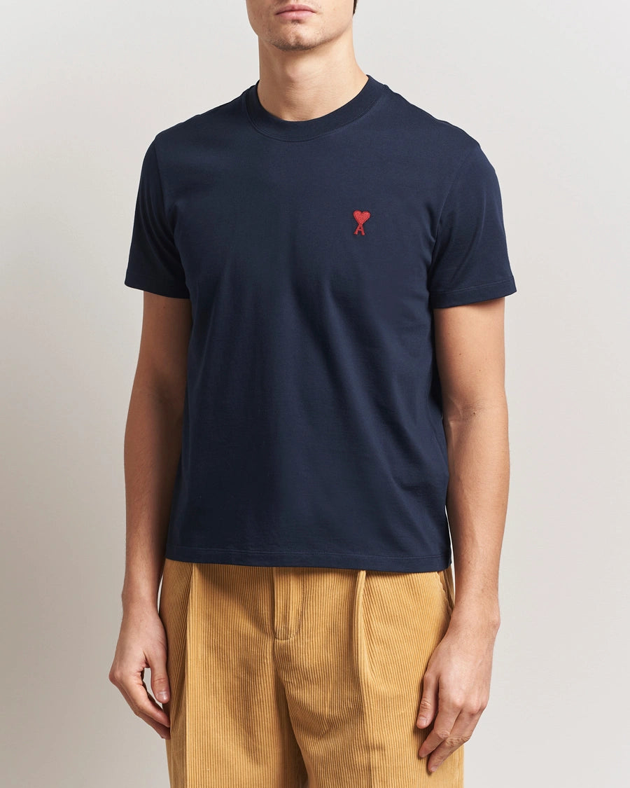 AMI Paris Heart Logo Men Tshirt in navy blue with red heart logo on chest.