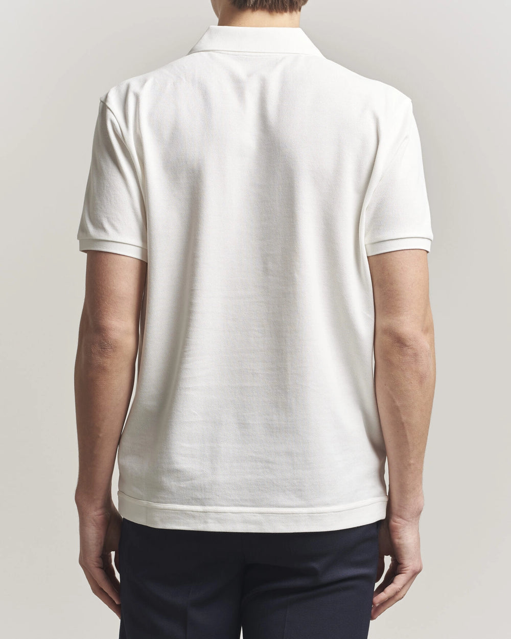 Moncler Luxury Logo Polo Shirt in white with logo on the chest and classic polo design.