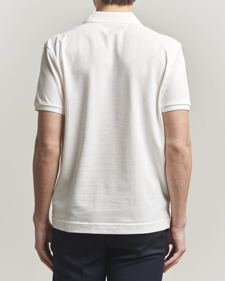 Moncler Luxury Logo Polo Shirt in white with logo on the chest and classic polo design.