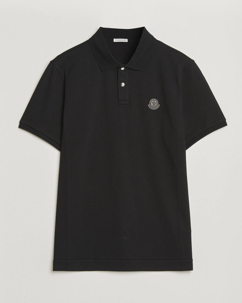Moncler Luxury Logo Polo Shirt in black with logo on the chest and classic polo design.