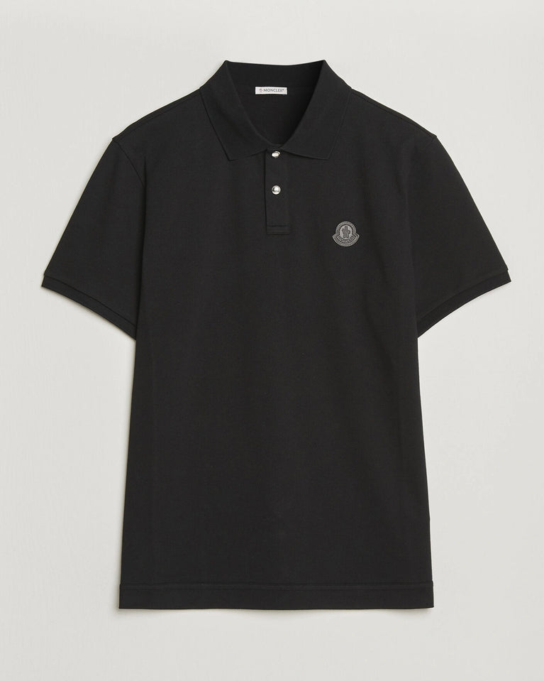 Moncler Luxury Logo Polo Shirt in black with logo on the chest and classic polo design.