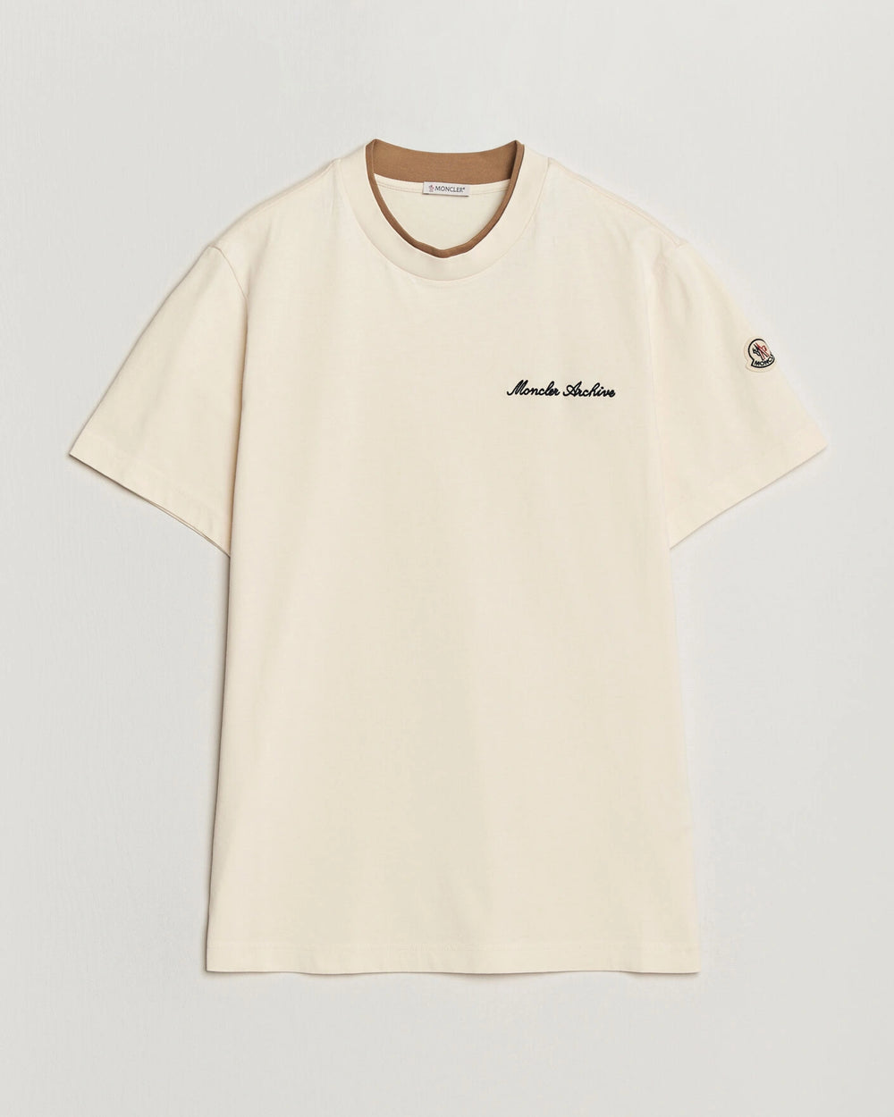 Moncler Men Signature Logo Tshirt displayed in Off white, featuring logo detail and contrasting neckline.