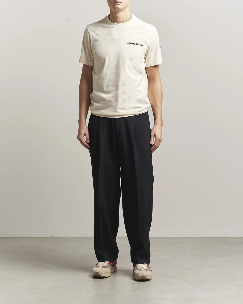 Moncler Men Signature Logo Tshirt displayed in Off white, featuring logo detail and contrasting neckline.