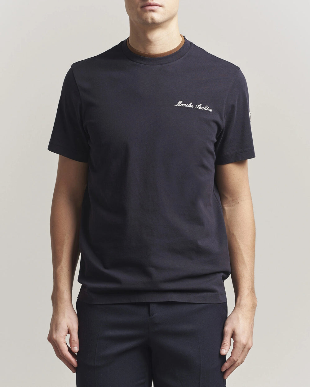 Moncler Men Signature Logo Tshirt displayed in Navy, featuring logo detail and contrasting neckline.