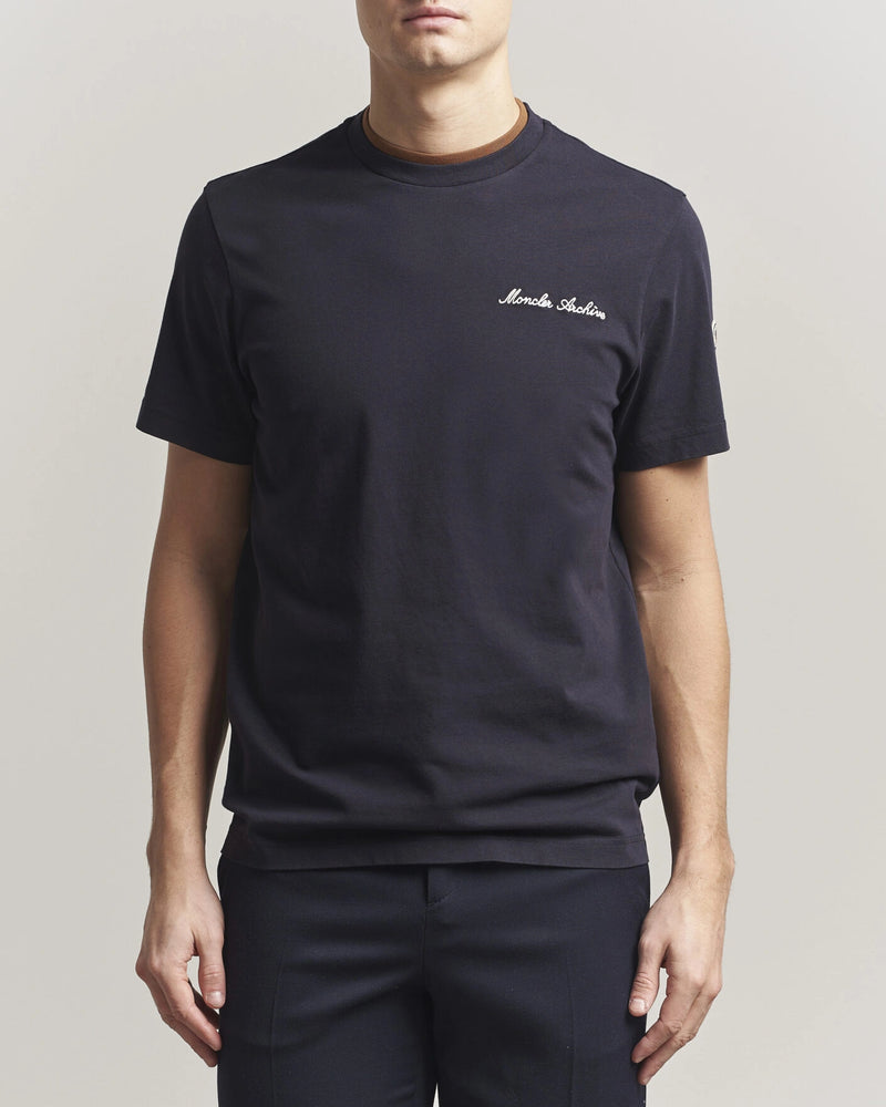 Moncler Men Signature Logo Tshirt displayed in Navy, featuring logo detail and contrasting neckline.