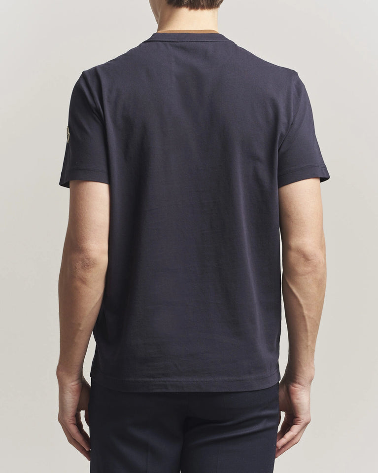 Moncler Men Signature Logo Tshirt displayed in Navy, featuring logo detail and contrasting neckline.