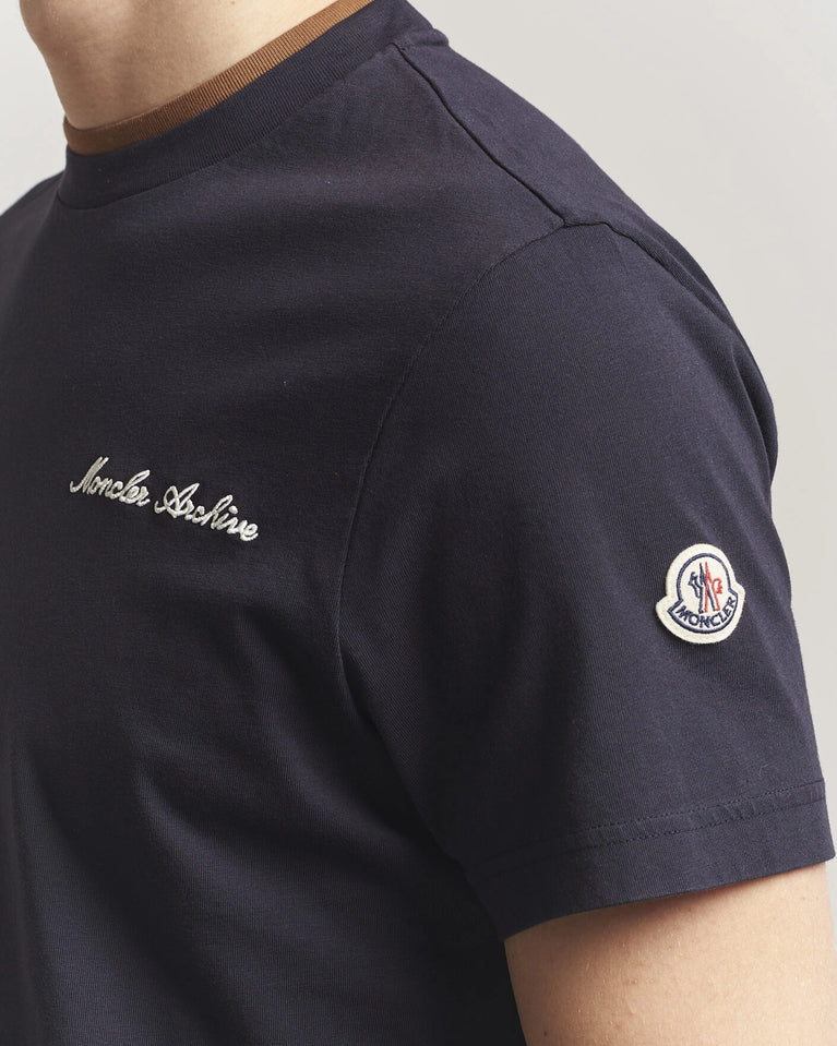 Moncler Men Signature Logo Tshirt displayed in Navy, featuring logo detail and contrasting neckline.