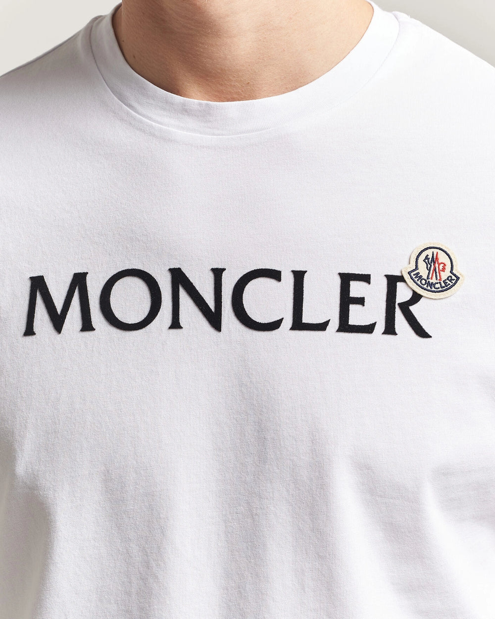 Moncler Men Lettering Logo Tshirt in white featuring a bold logo