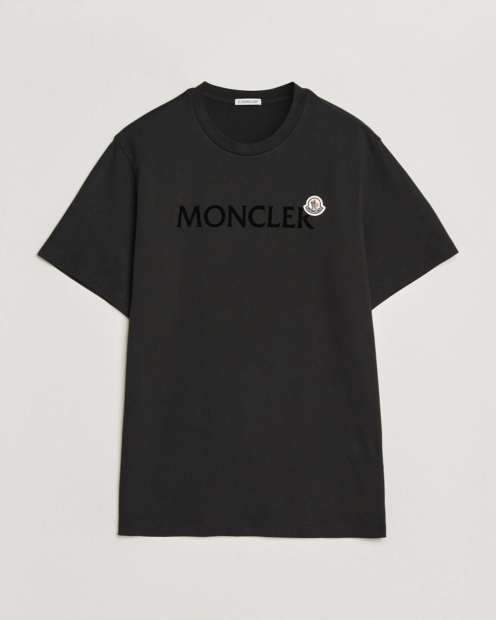 Moncler Men Lettering Logo Tshirt in black featuring a bold logo
