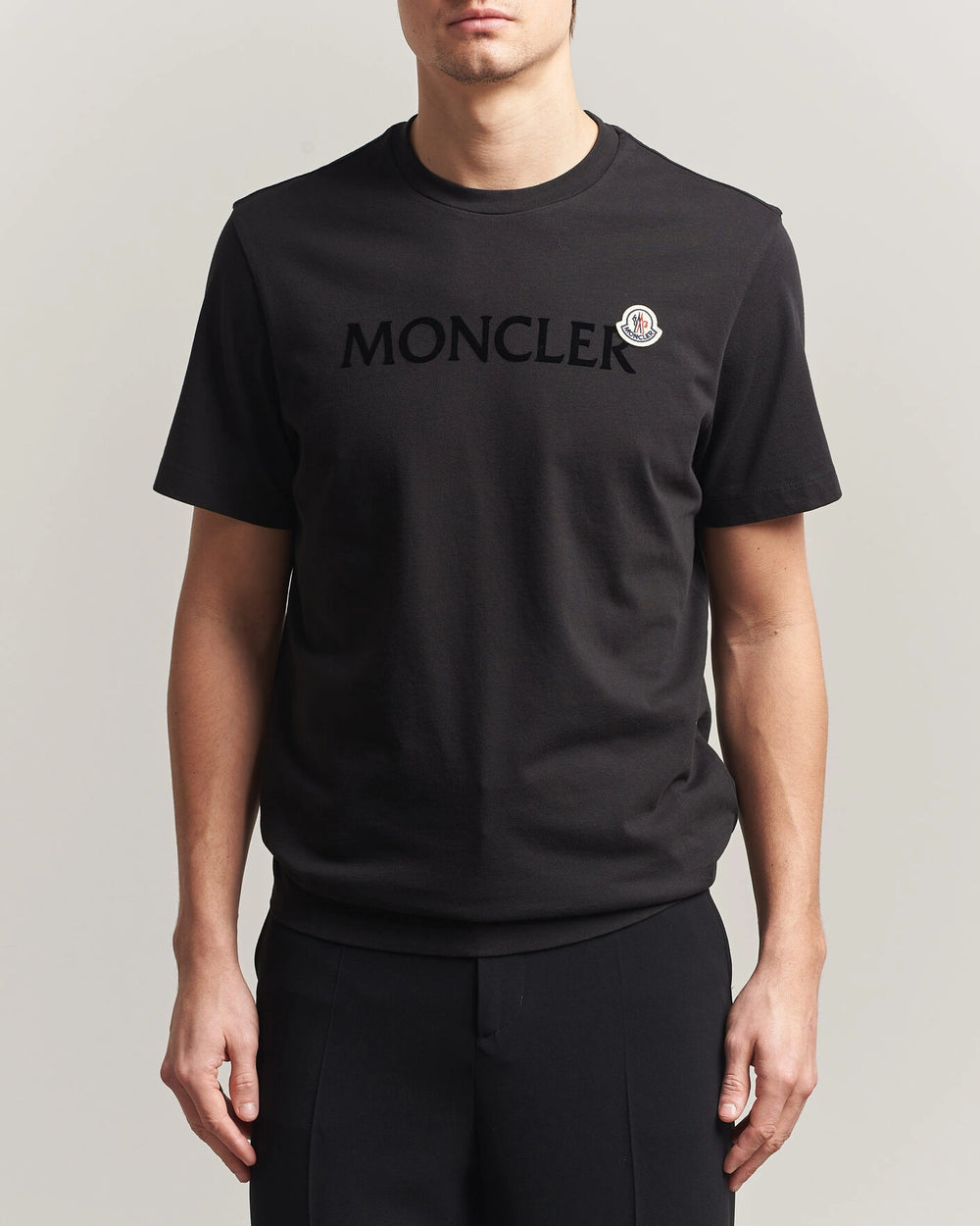 Moncler Men Lettering Logo Tshirt in black featuring a bold logo