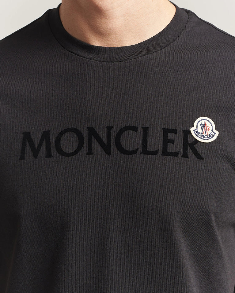 Moncler Men Lettering Logo Tshirt in black featuring a bold logo