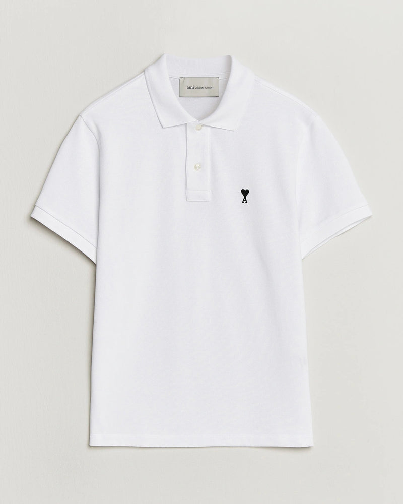 AMI Paris Heart Logo Men Polo Shirt in white featuring a signature heart logo on the chest.