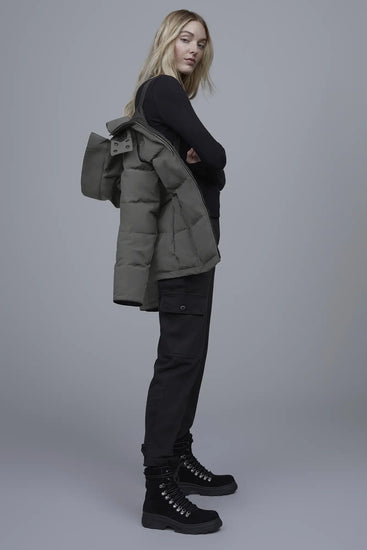 Woman wearing a green puffer Canada Goose Chelsea Parka Women's Down Winter Jacket at Volonka store.
