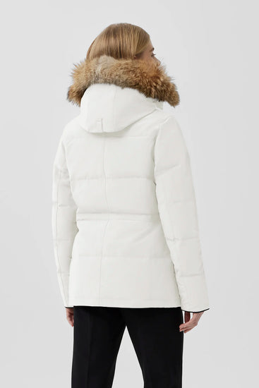 Woman wearing a white puffer jacket with fur hood, Canada Goose Chelsea Parka Women's Down Winter Jacket at Volonka store.
