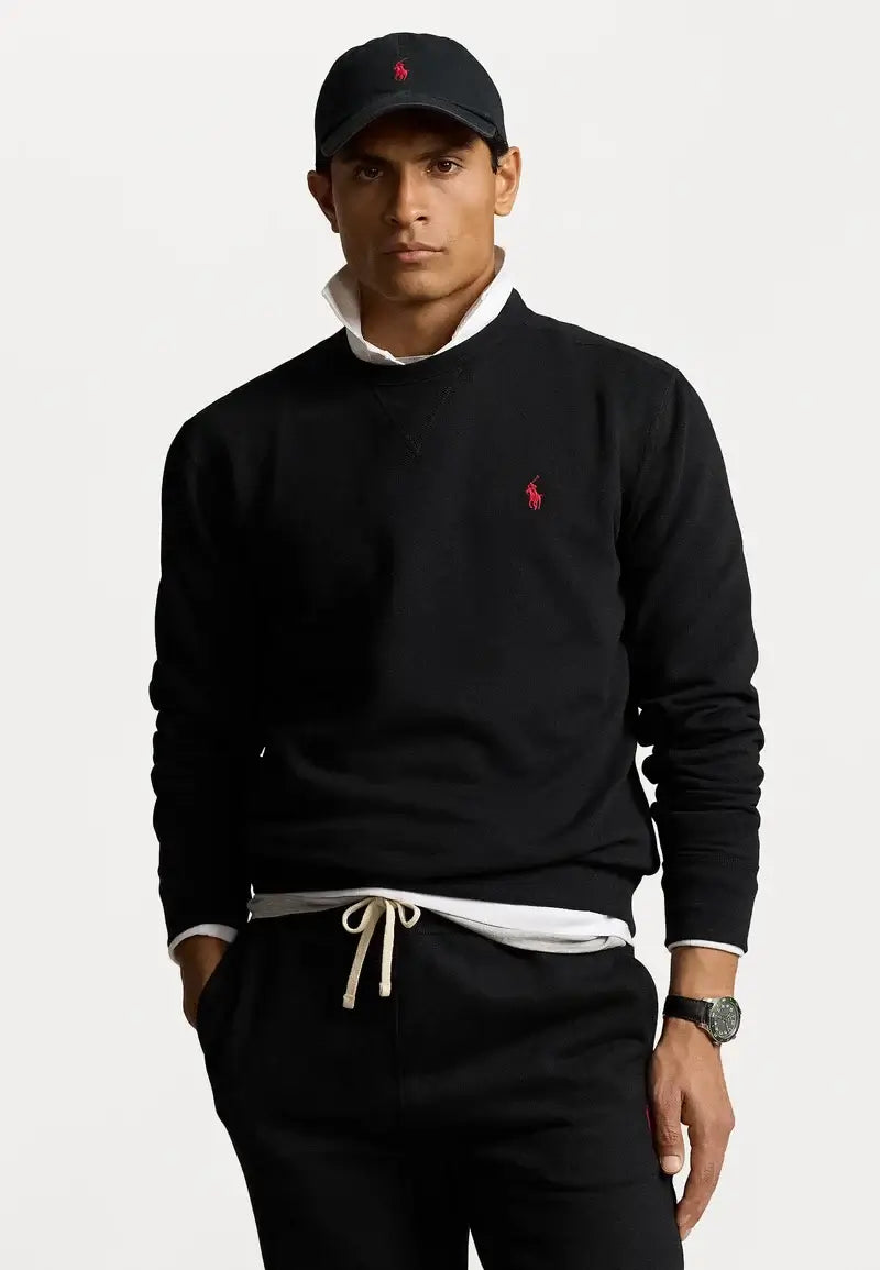 Man wearing Polo Ralph Lauren black sweatshirt and black cap