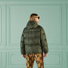 man wearing green quilted Gucci jacket and sunglasses