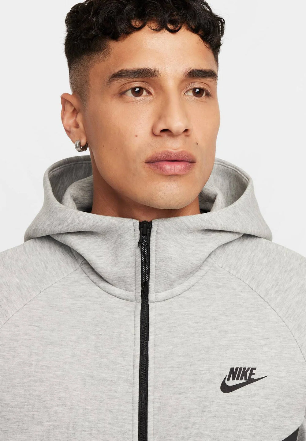 Shop Nike Sportswear Tech Fleece Hoodie & Joggers Set Grey for warmth, comfort, and style. Perfect for everyday wear with a sleek modern fit.