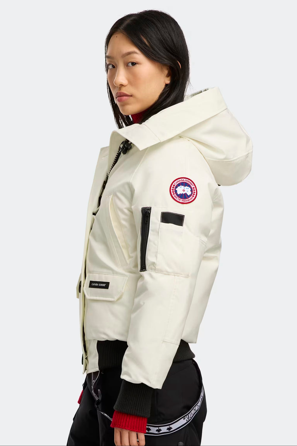 woman wearing a white Canada Goose jacket. Canada Goose Chilliwack Bomber Women's Winter Hooded Jacket