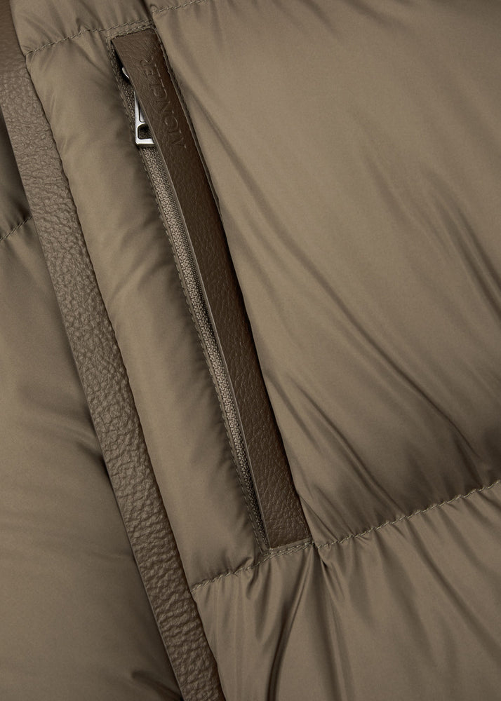 Close-up of Moncler brown puffer jacket with a zipper