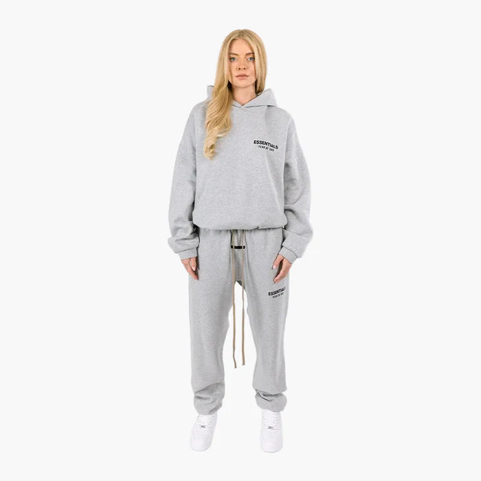 FEAR OF GOD ESSENTIALS Sweatpant in gray, featuring a comfortable fit and minimalist design for stylish loungewear. FEAR OF GOD ESSENTIALS Sweatpant in gray, featuring a comfortable fit and minimalist design for stylish loungewear.