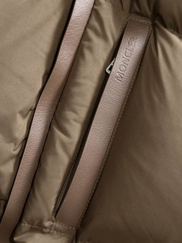 Close-up of a brown Moncler jacket with a strap.