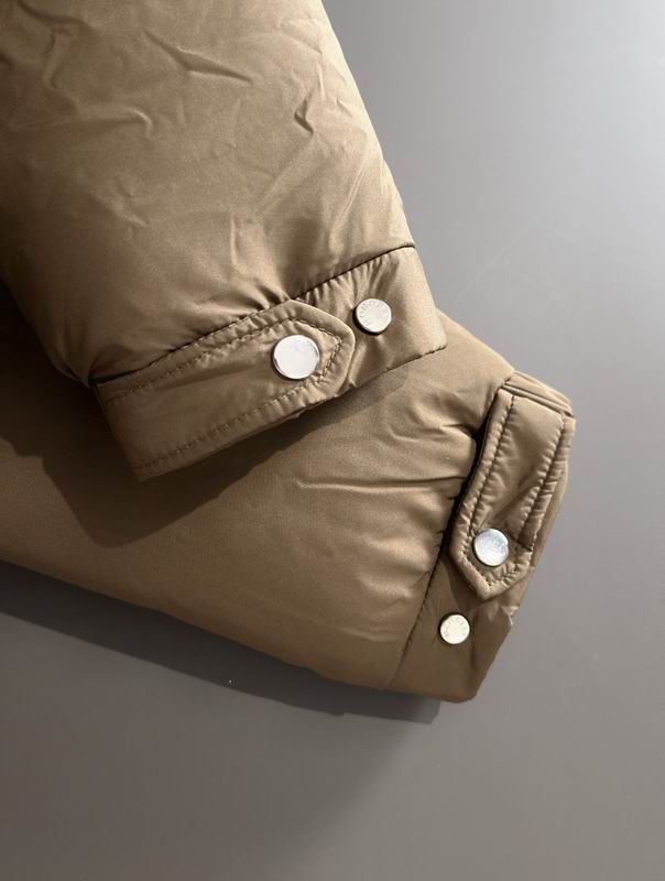 Close-up of a brown jacket with button details on a gray background