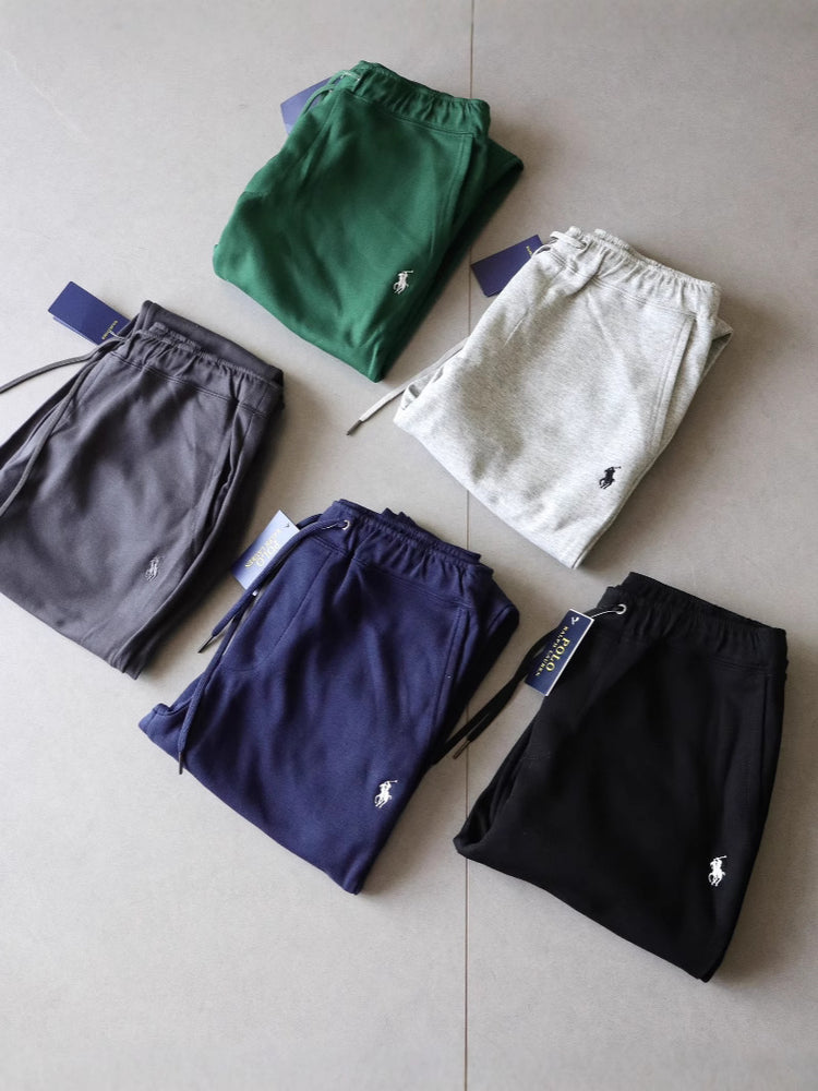 Five pairs of Ralph Lauren Unisex High-Grade Casual Sweatpants in green, gray, navy, and black on a light gray surface.