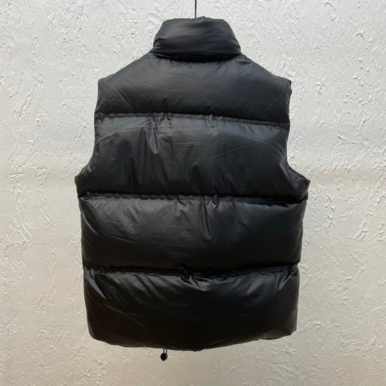 Black puffer vest hanging. Prada Men's light Down Vest jacket