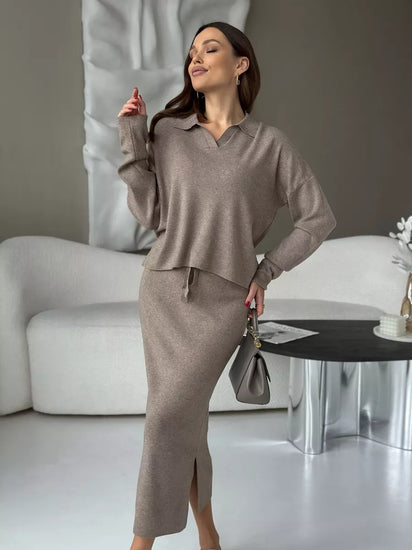 Woman in a beige outfit standing in a modern living room. Chic Elegant Soft Knit Sweater with Skirt Set