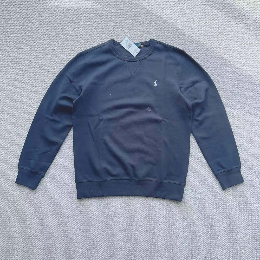Navy blue Polo Ralph Lauren crew neck sweatshirt laid flat on white background