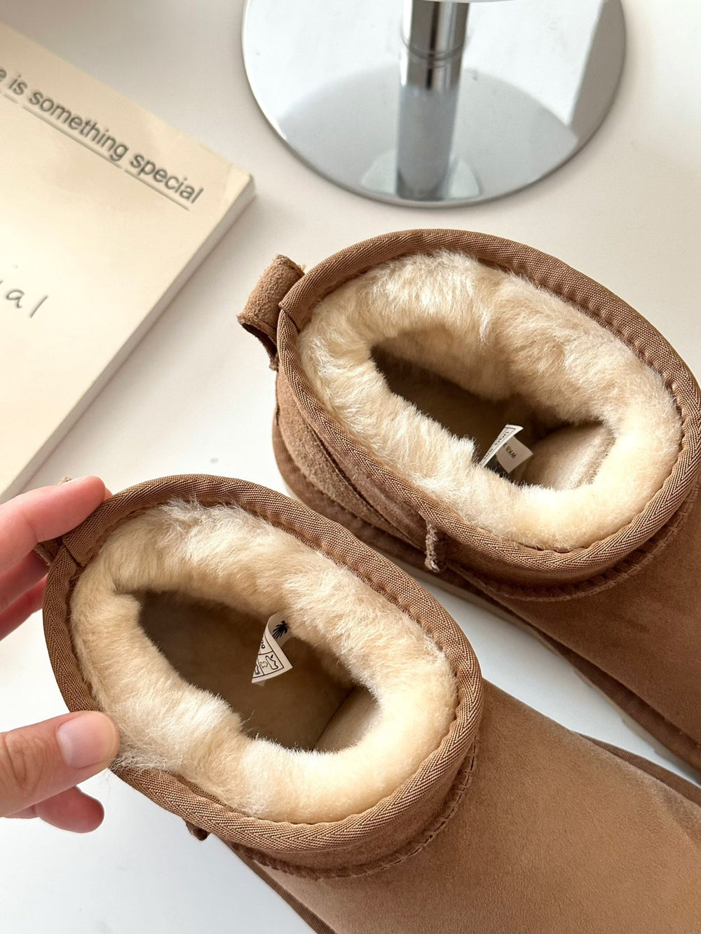 Brown slippers with fluffy interior in volonka store. UGG Classic Ultra Mini Women's Warm Wool Snow Boots
