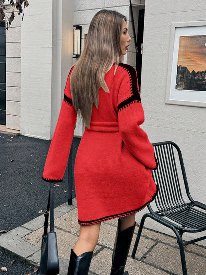 Woman wearing a red dress with black trim standing outdoors. Womens Knit V-Neck Midi Dress Tie-Waist Loose Autumn Style