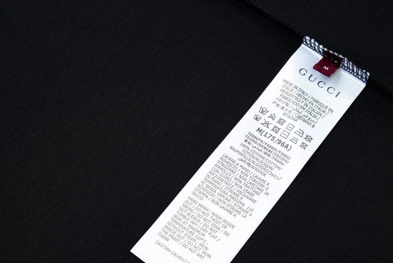 Gucci tag on a black background