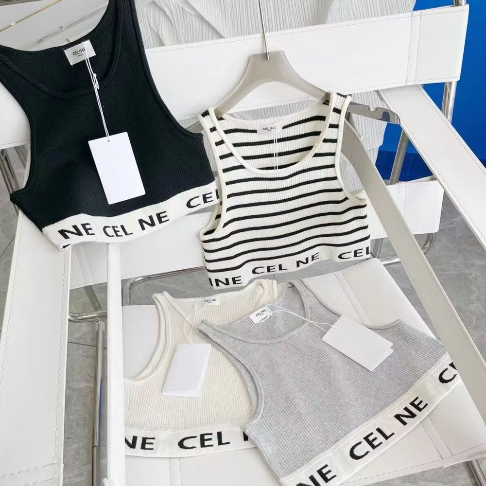 Four tank tops with visible brand tags on a chair. Celine original Bra In Athletic Knit