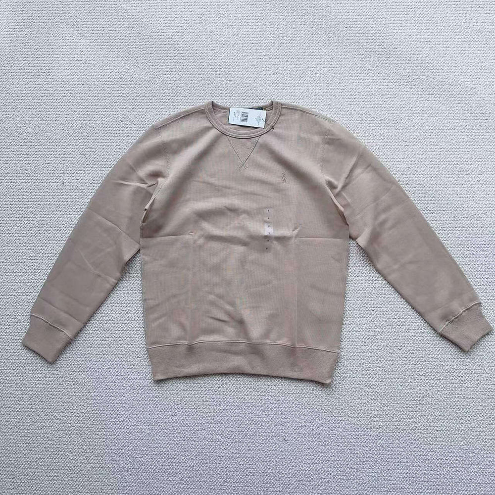Beige Polo Ralph Lauren crew neck sweatshirt laid flat on white background
