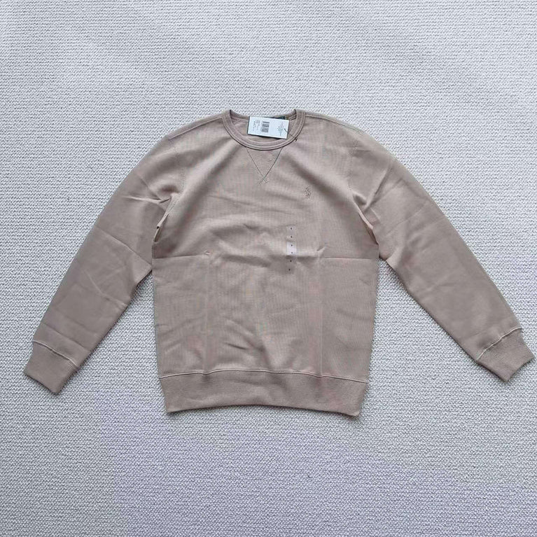 Beige Polo Ralph Lauren crew neck sweatshirt laid flat on white background