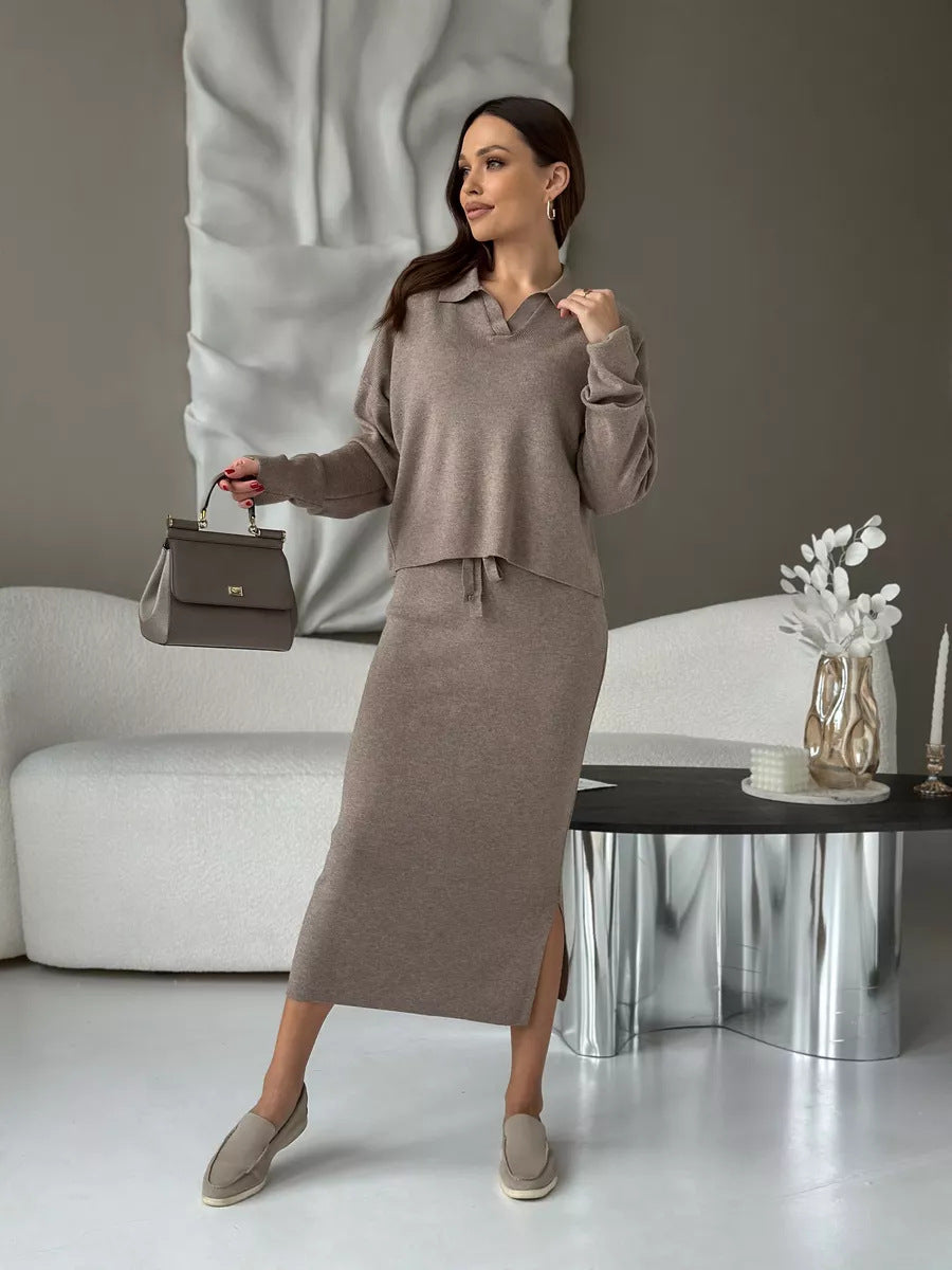 Woman in a gray outfit holding a handbag. Chic Elegant Soft Knit Sweater with Skirt Set